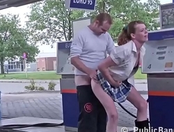 Kinky babe is kissing a guy at the Gas Station