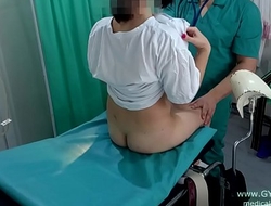 Girl with pigtails on examination at the gynecologist